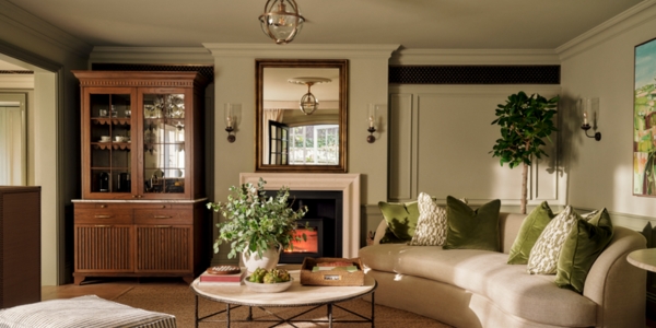 a living room with sofas and a fireplace